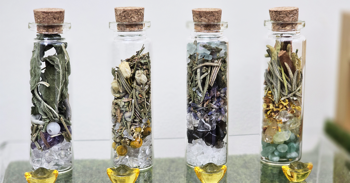 Energy Booster Bottle infused with quartz and herbs for spiritual vitality.