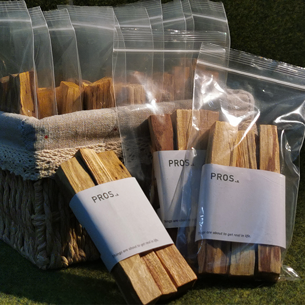 Palo Santo sticks burning with aromatic smoke, ideal for cleansing energy.